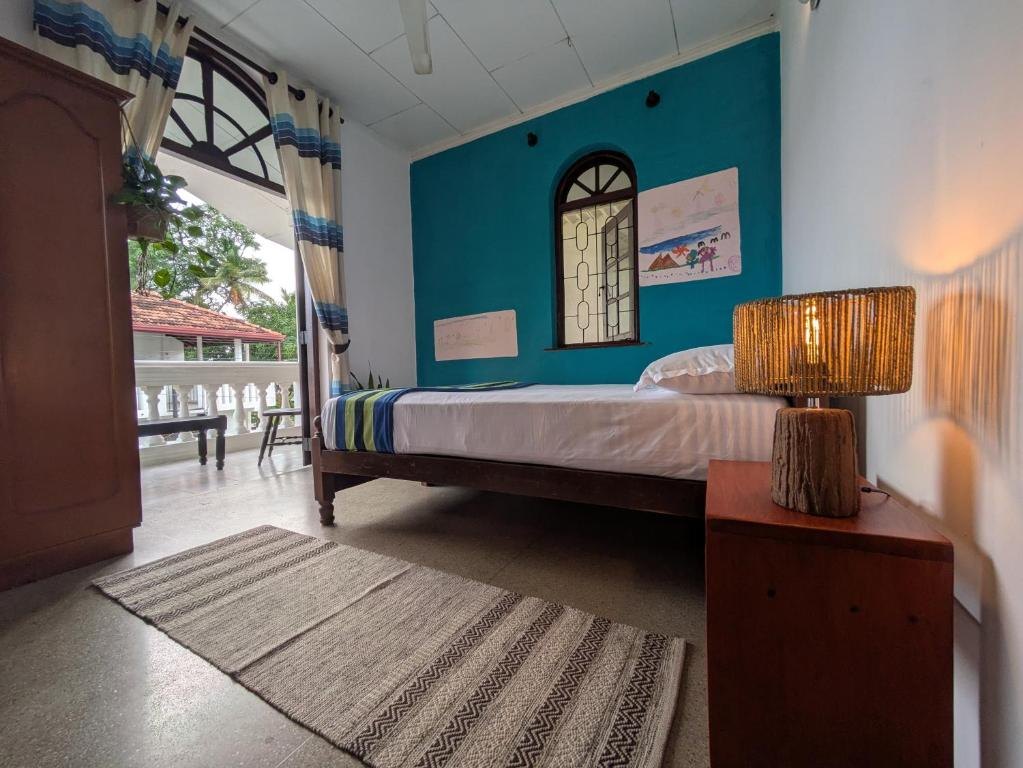 Guest room opening to balcony at Airport Gateway Residence